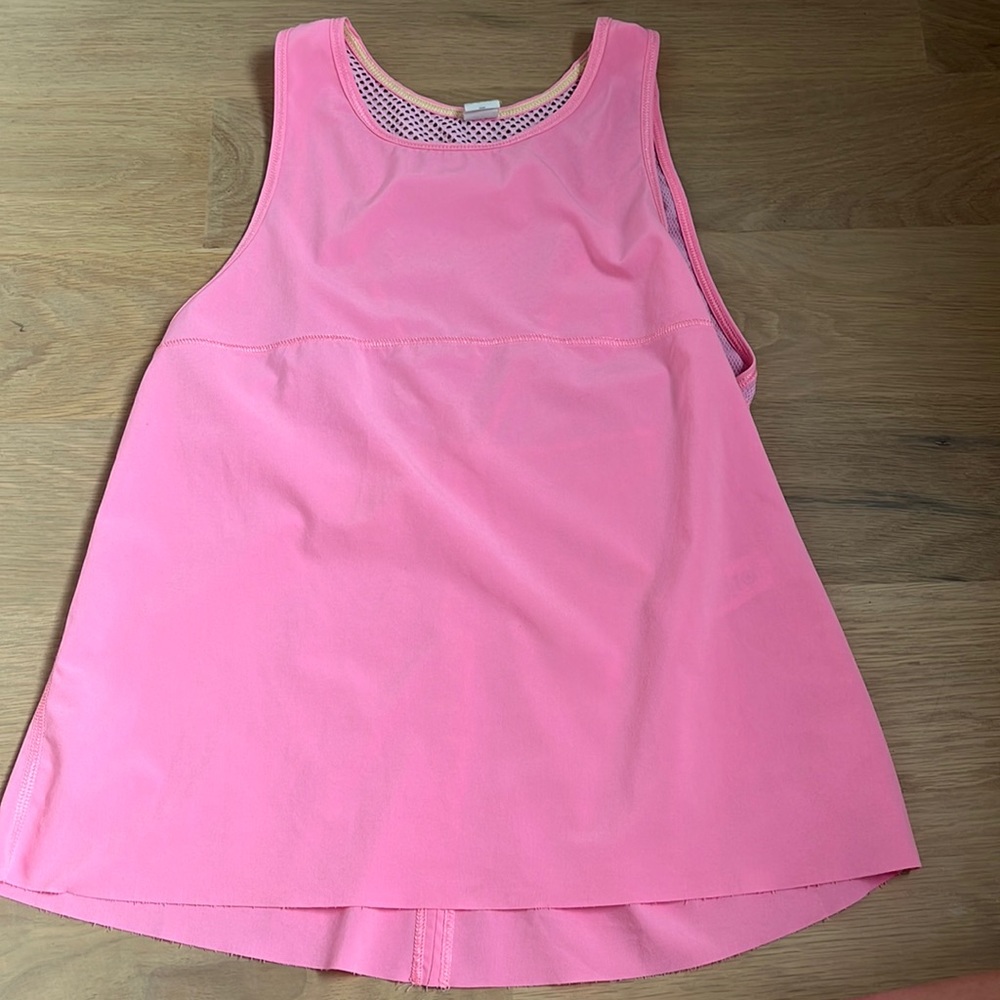 Pink athletic top with net on the back